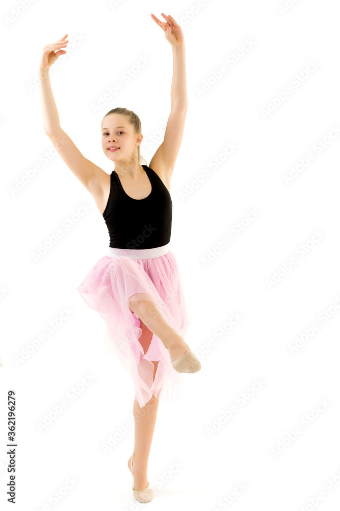 Teenage Girl Gymnast Standing on Tiptoe and Looking to the Side of floor. Teenage Girl Gymnast Standing on Tiptoe and Looking to the Side of floor.