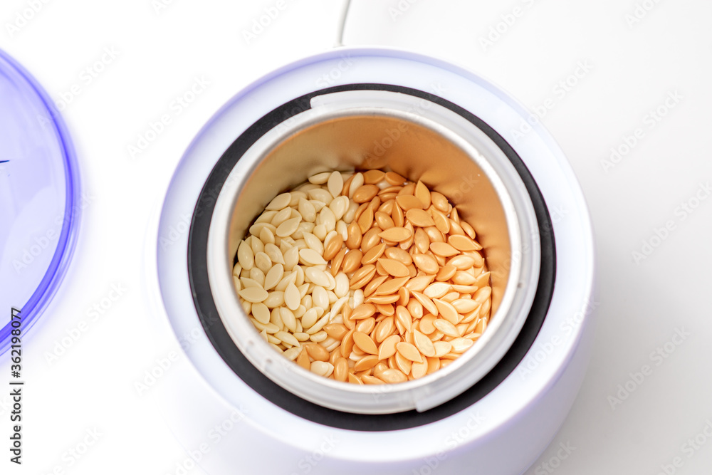 Electric wax warmer or wax heater with wax drops inside while heating the wax Electric wax warmer or wax heater with wax drops inside while heating the wax