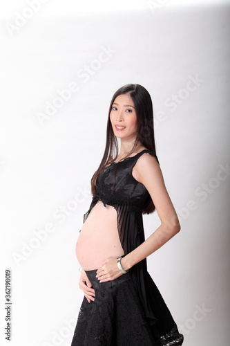 six months pregnant on white background.
