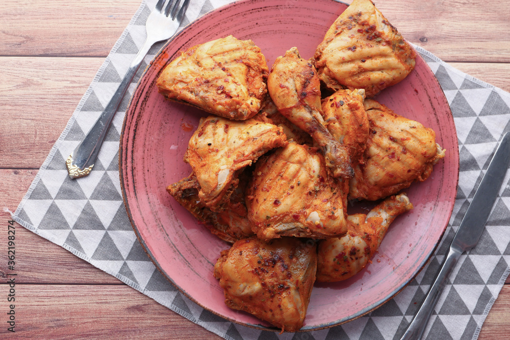 Grilled chicken fillets on plate. top down. Grilled chicken fillets on plate. top down.