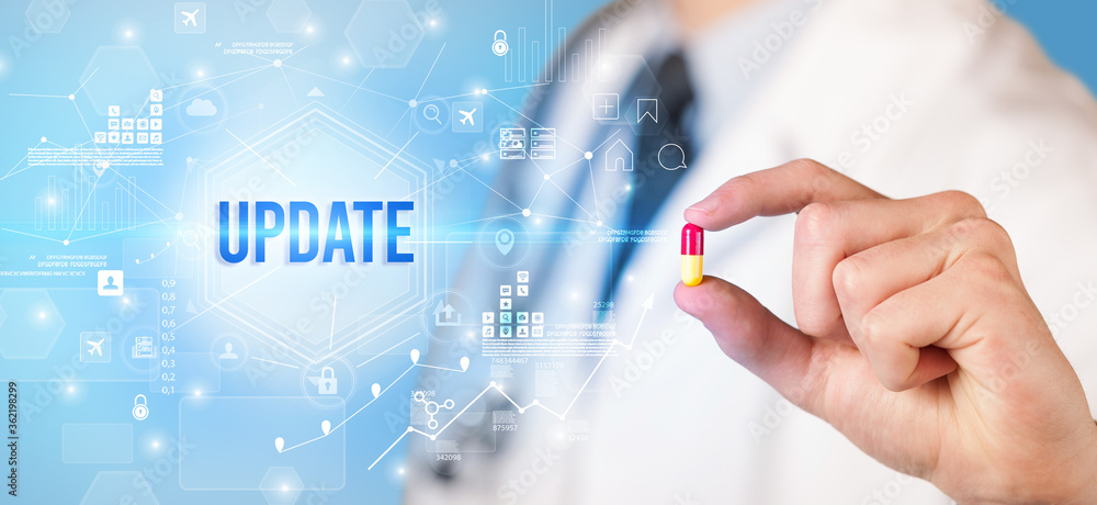 Doctor giving a pill with UPDATE inscription, new technology solution concept Doctor giving a pill with UPDATE inscription, new technology solution concept