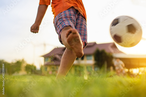 action sport picture of a group of kids playing soccer football for exercise