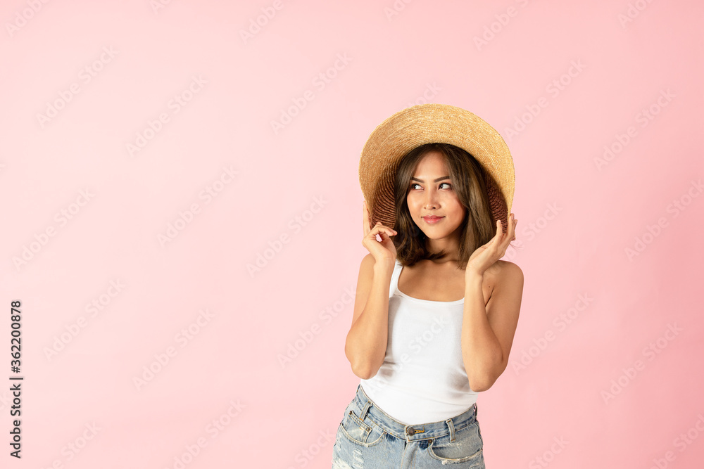 Asian women tourists wear summer clothes. Isolated on pink background Asian women tourists wear summer clothes. Isolated on pink background