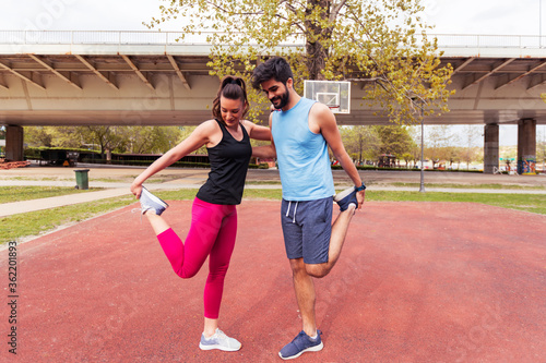 Active fitness couple preparing for running