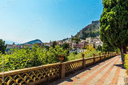 A view along the promenade of the Garden of Villa Comunale, Taormina, Sicily in summer