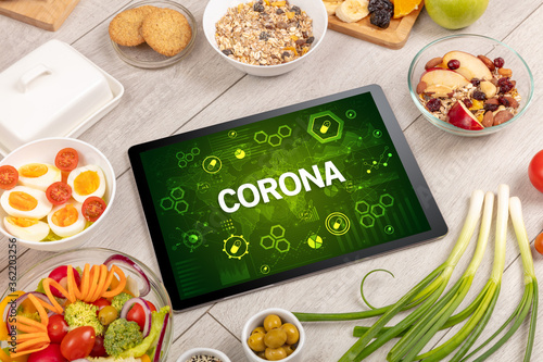 Healthy Tablet Pc compostion with CORONA inscription, immune system boost concept