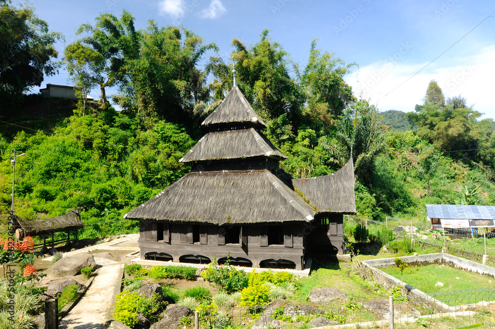 WEST SUMATERA, INDONESIA -JUNE 8, 2014: Tuo Kayu Jao Mosque is located in West Sumatra, Indonesia. Built in 1599 and is the second oldest mosque in Indonesia. WEST SUMATERA, INDONESIA -JUNE 8, 2014: Tuo Kayu Jao Mosque is located in West Sumatra, Indonesia. Built in 1599 and is the second oldest mosque in Indonesia.