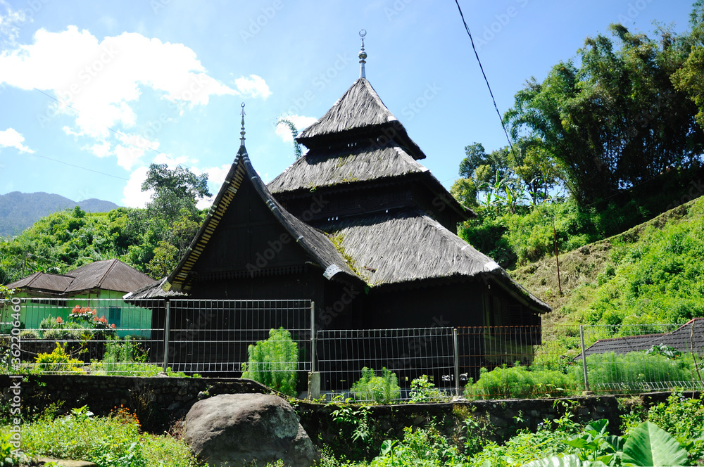 WEST SUMATERA, INDONESIA -JUNE 8, 2014: Tuo Kayu Jao Mosque is located in West Sumatra, Indonesia. Built in 1599 and is the second oldest mosque in Indonesia. WEST SUMATERA, INDONESIA -JUNE 8, 2014: Tuo Kayu Jao Mosque is located in West Sumatra, Indonesia. Built in 1599 and is the second oldest mosque in Indonesia.