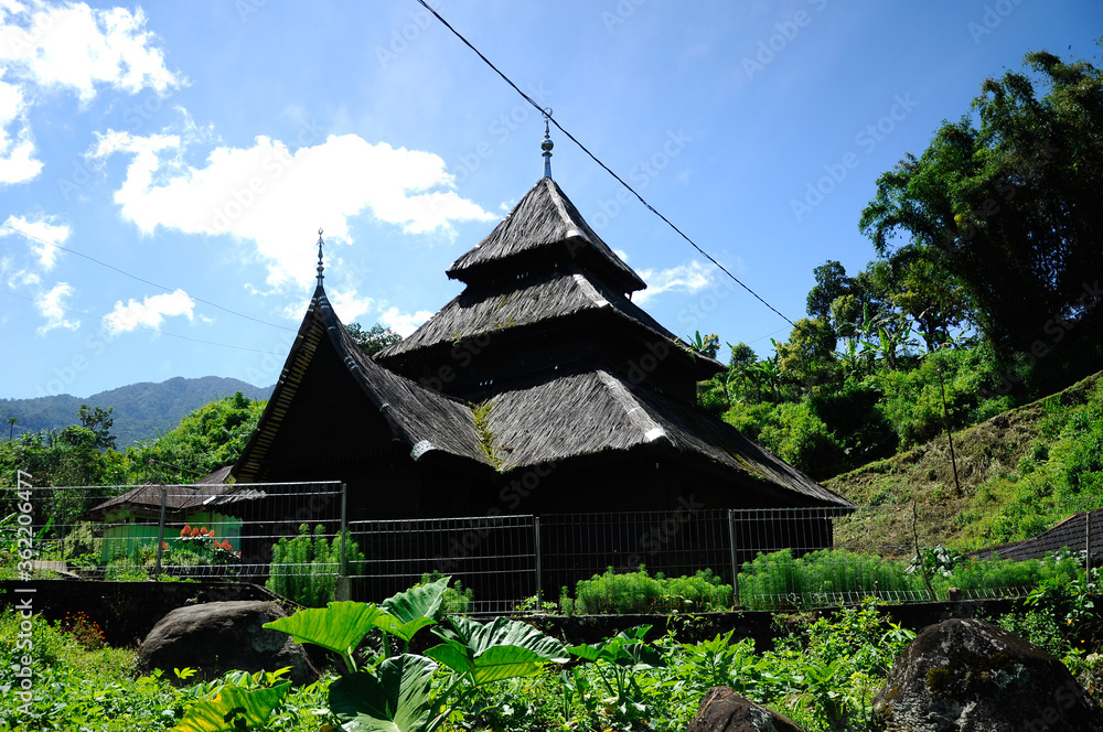 WEST SUMATERA, INDONESIA -JUNE 8, 2014: Tuo Kayu Jao Mosque is located in West Sumatra, Indonesia. Built in 1599 and is the second oldest mosque in Indonesia. WEST SUMATERA, INDONESIA -JUNE 8, 2014: Tuo Kayu Jao Mosque is located in West Sumatra, Indonesia. Built in 1599 and is the second oldest mosque in Indonesia.