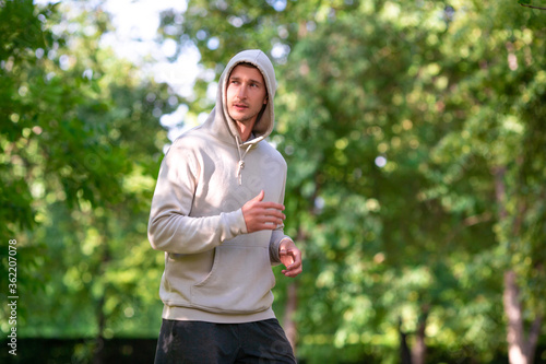 Male runner is training in the park.
