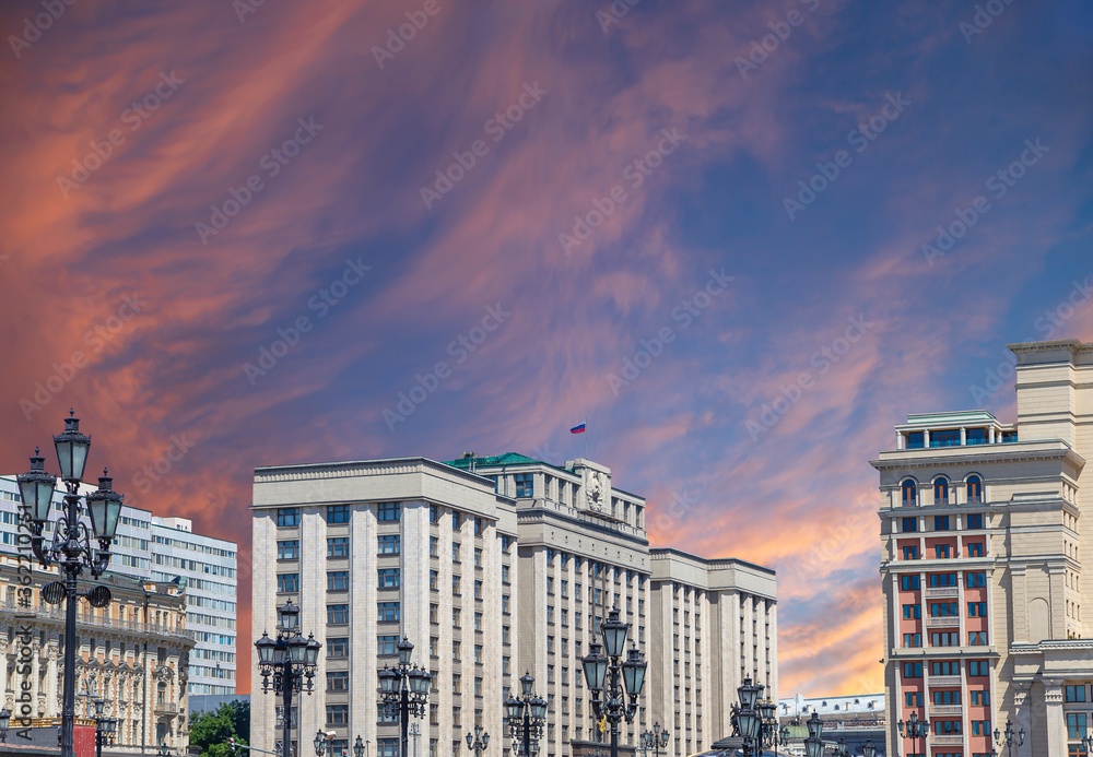 Building of The State Duma of the Federal Assembly of Russian Federation on a beautiful sky with cloud before sunset background, Moscow, Russia