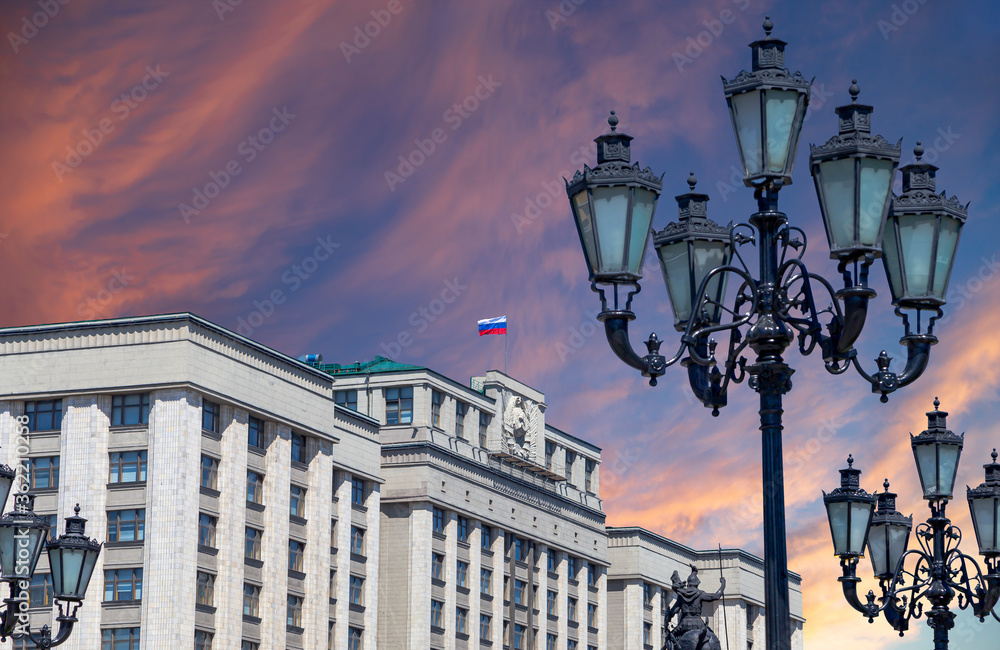 Building of The State Duma of the Federal Assembly of Russian Federation on a beautiful sky with cloud before sunset background, Moscow, Russia