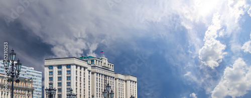 Building of The State Duma of the Federal Assembly of Russian Federation on a cloud background, Moscow, Russia photo