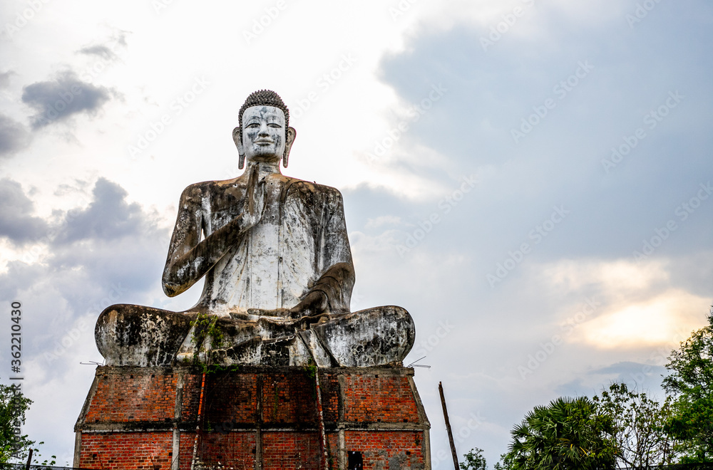 Buddha statue of the temple of Wat Ek Phnom near the city of Battambang in Cambodia Buddha statue of the temple of Wat Ek Phnom near the city of Battambang in Cambodia