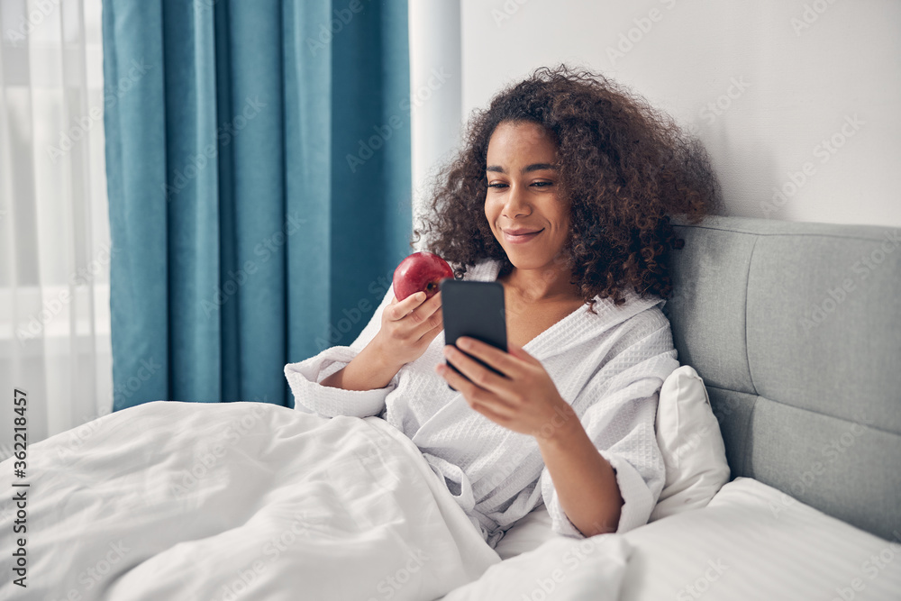 Happy cute woman reading a text message Happy cute woman reading a text message
