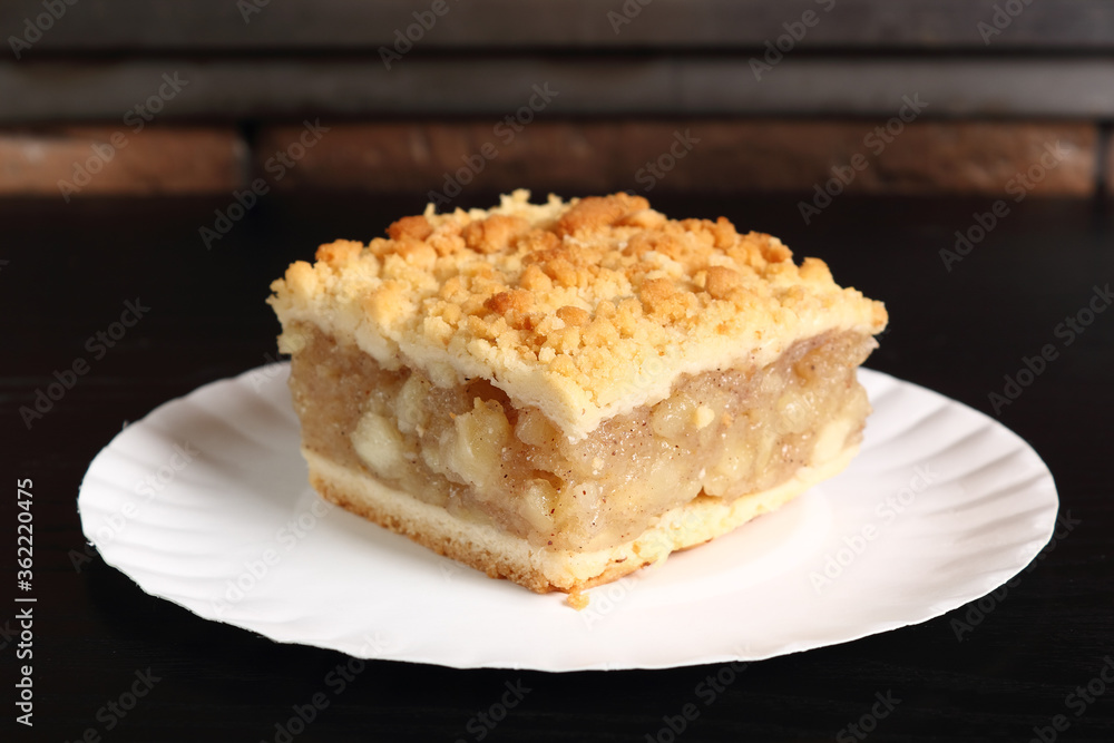 Apple Pie on disposable paper plate. Double crust apple pie with cinnamon made with shortcrust pastry. Apple Pie on disposable paper plate. Double crust apple pie with cinnamon made with shortcrust pastry.
