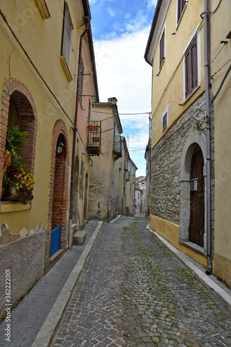 Fototapeta Naklejka Na Ścianę i Meble -  A street between the houses of the old town of Santa Maria del Molise, Italy.