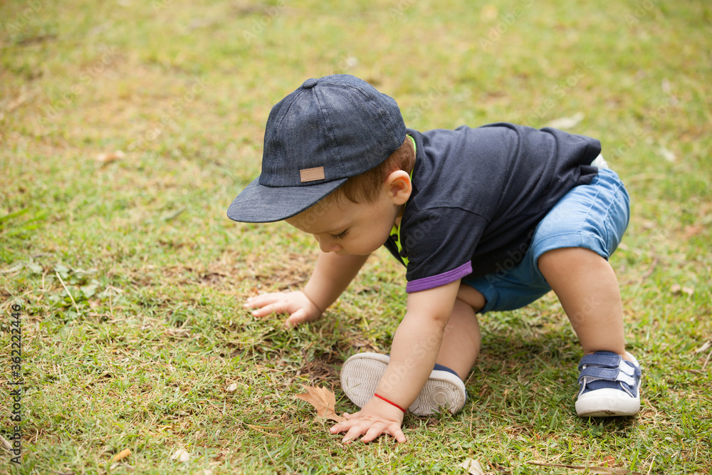 baby boy in a park baby boy in a park