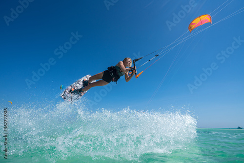 Kite girl rides in the ocean clear water © ohrim