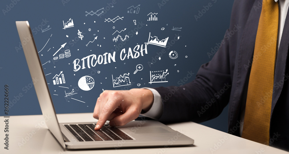 Businessman working on laptop with BITCOIN CASH inscription, modern business concept Businessman working on laptop with BITCOIN CASH inscription, modern business concept