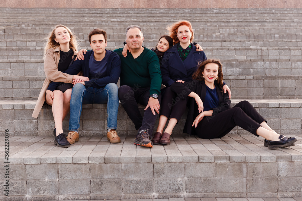 Fototapeta premium a large family of children and parents. a family of six look into the camera.