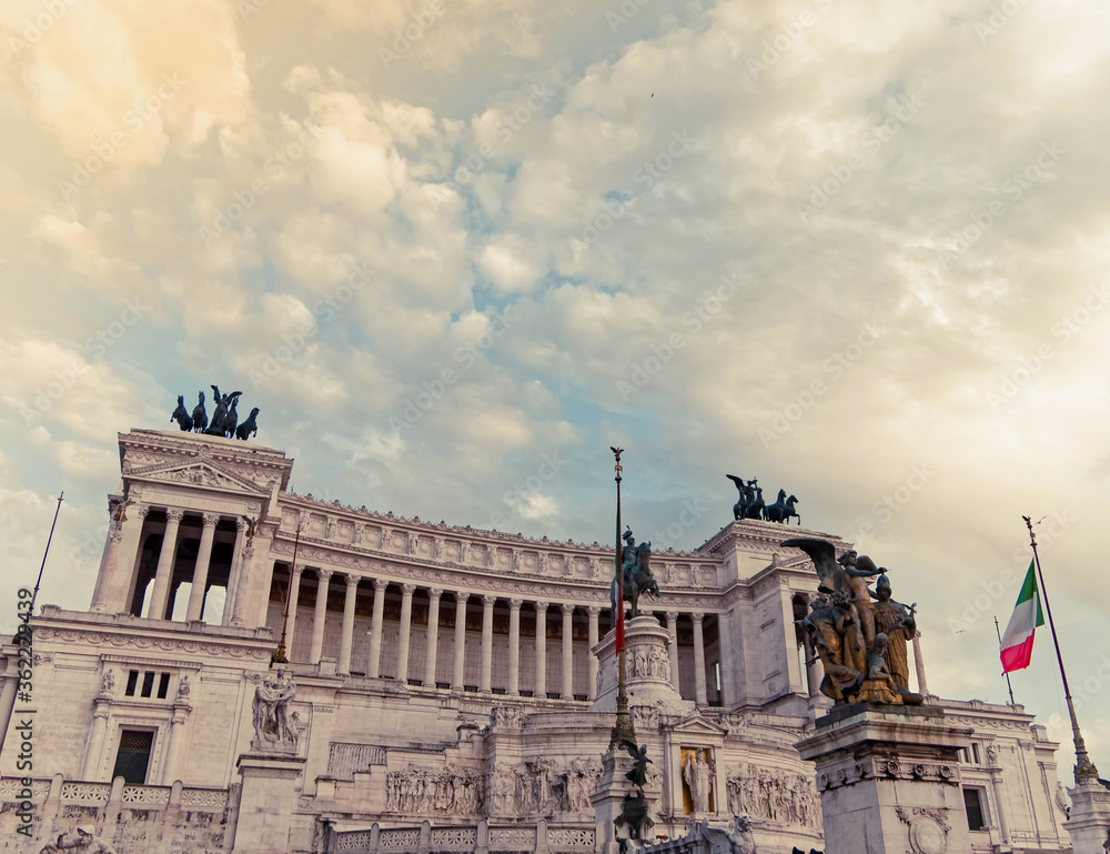 Rome Italy, King Vittorio Emanuele monument impressive facade under cloudy sky, filtered image