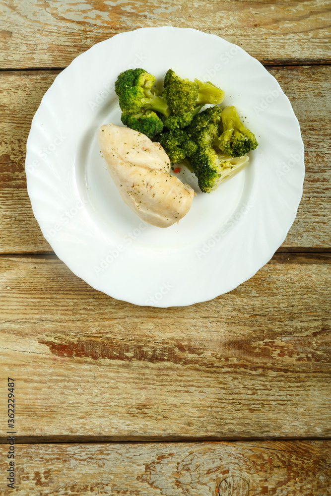 Boiled broccoli and chicken breast diet on a plate. Boiled broccoli and chicken breast diet on a plate.