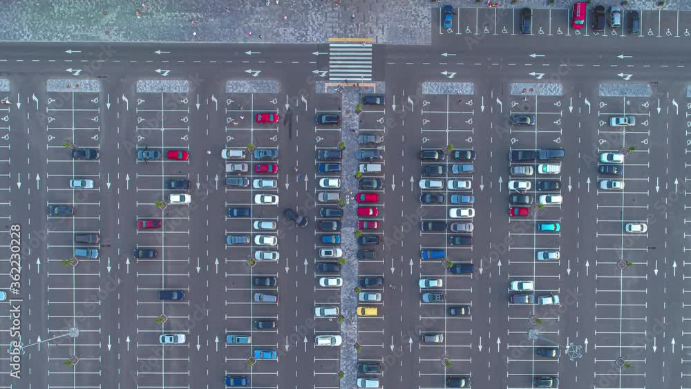 The aerial view on car motion on the parking. time lapse The aerial view on car motion on the parking. time lapse