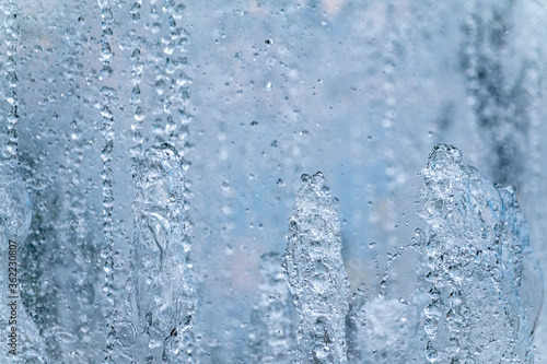 Splashes of water against light background.