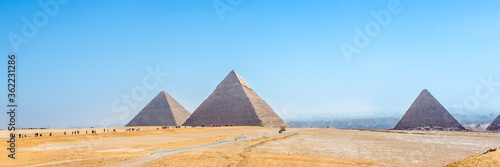 The pyramids at Giza in Egypt. Web banner in panoramic view.