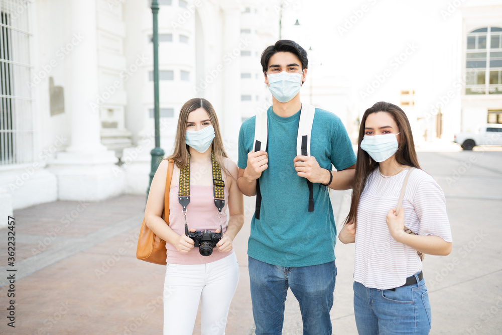 Friends Wearing Face Masks In City