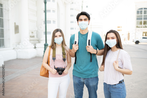 Friends Wearing Face Masks In City