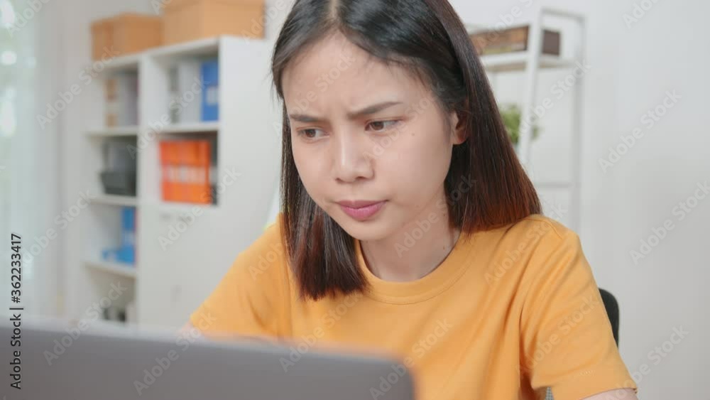 Asian business women feeling strain from hard work and from using the computer for a long time in the desk office room. Asian business women feeling strain from hard work and from using the computer for a long time in the desk office room.
