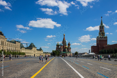 Red square with a General view of the Kremlin's Spasskaya tower and St. Basil's Cathedral on a bright Sunny day