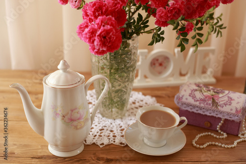 summer morning with the scent of roses and tea with milk