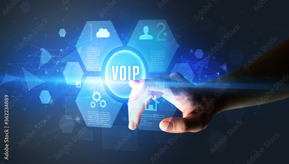 Hand touching VOIP inscription, new technology concept Hand touching VOIP inscription, new technology concept