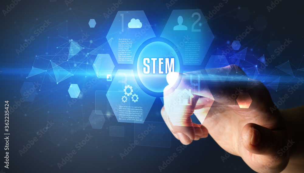 Hand touching STEM inscription, new technology concept Hand touching STEM inscription, new technology concept