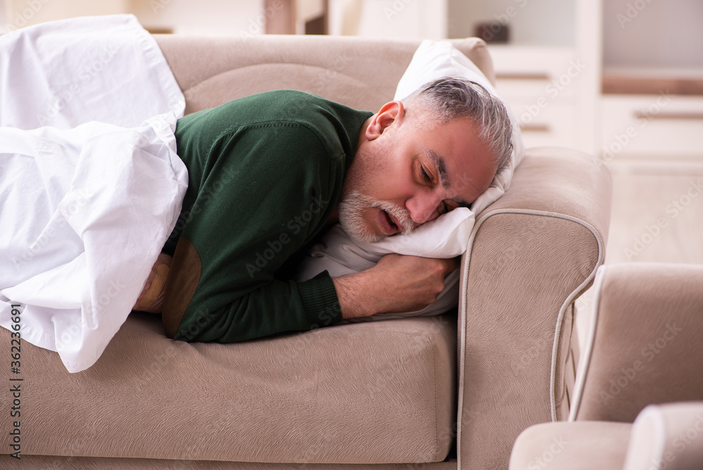 Old man suffering at home Old man suffering at home