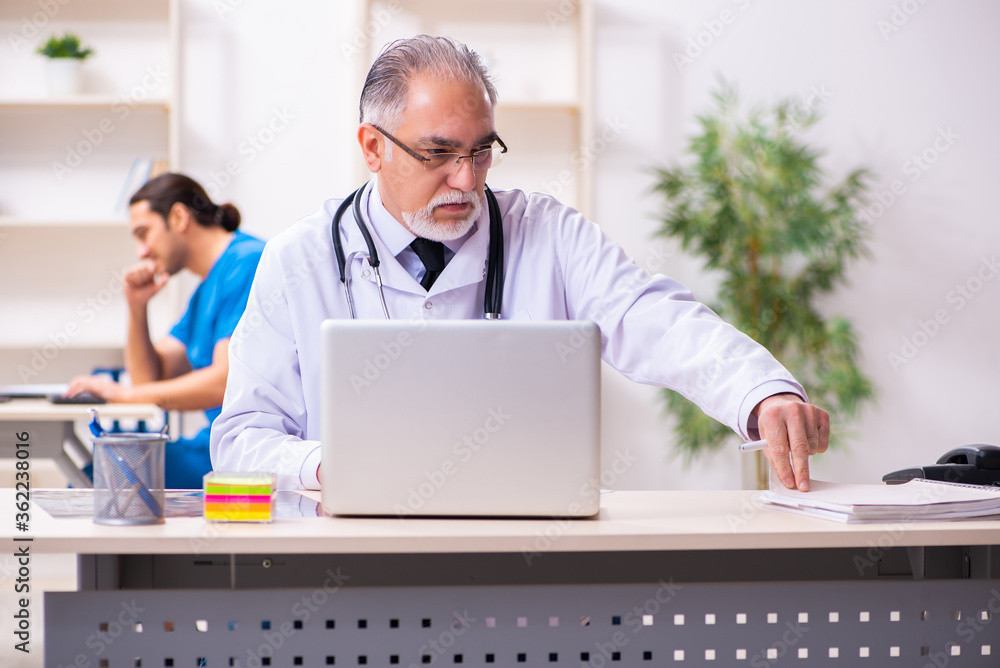 Two male doctors working in the clinic Two male doctors working in the clinic