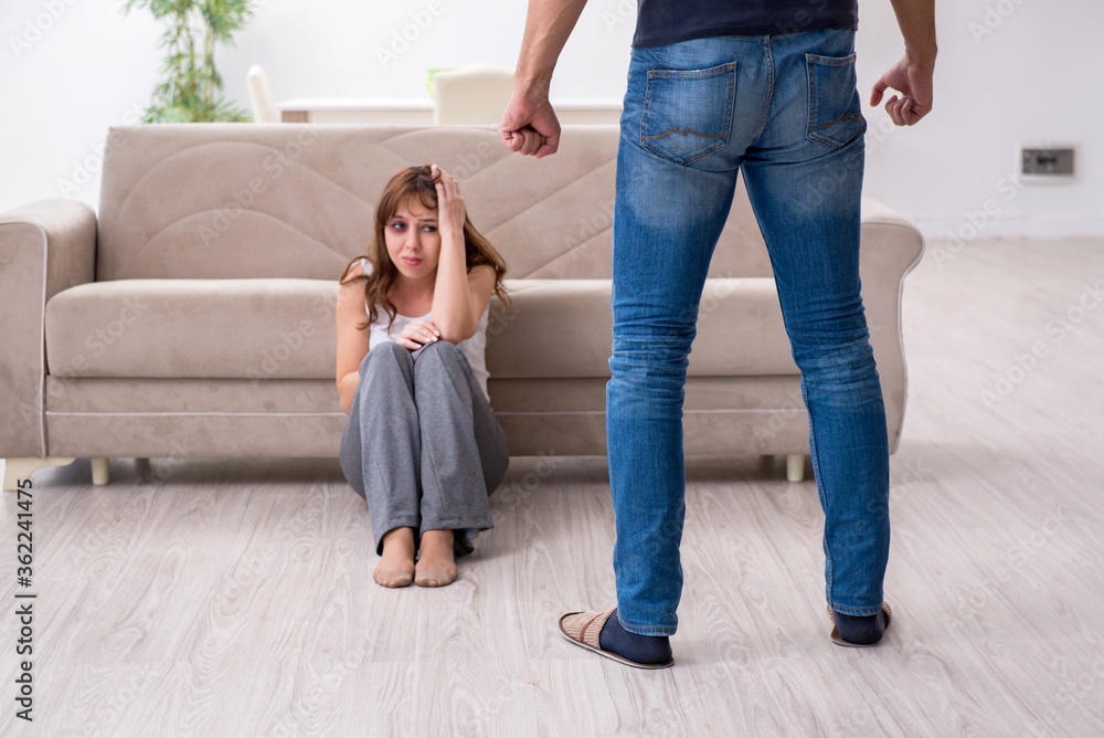 Young couple in domestic violence concept Young couple in domestic violence concept