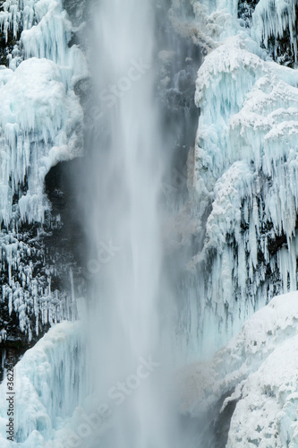 Multnomah Falls  after a winter snow and ice storm  The falls is in the Columbia River Gorge National Scenic Area, about 18 miles east of Portland, Oregon.