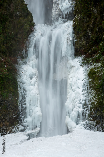 Multnomah Falls after a winter snow and ice storm. The falls is in the Columbia River Gorge National Scenic Area, about 18 miles east of Portland, Oregon.