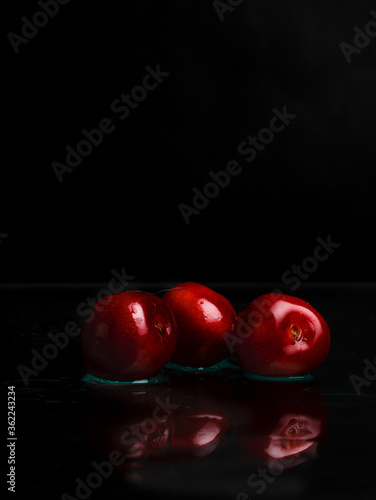 red apples on black background