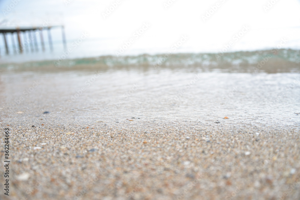 calm sea, small waves, clear and transparent water, small sand near the shore calm sea, small waves, clear and transparent water, small sand near the shore