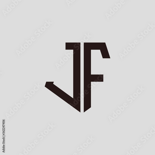 J F black pentagon initials with a gray background