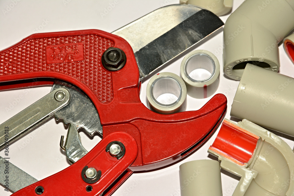 Plastic pipes and scissors for metal Plastic pipes and scissors for metal