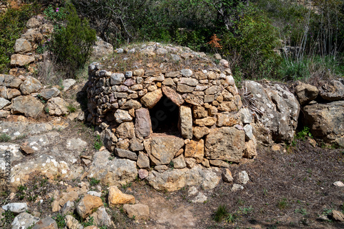 old stone bread oven in the valley of Paderne, Algarve,