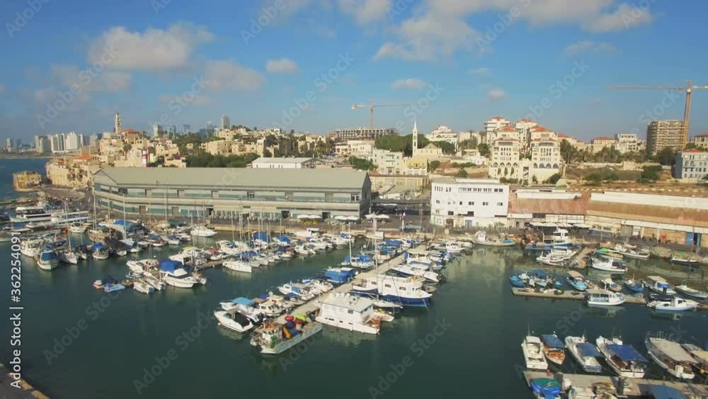 Tel Aviv Jaffa, Aerial View, Flying Over Old Jaffa Port and Saint Peter's church At Golden Hour, Tel-Aviv Skyline and the Mediterranean Sea, Israel, Orbit shot Tel Aviv Jaffa, Aerial View, Flying Over Old Jaffa Port and Saint Peter's church At Golden Hour, Tel-Aviv Skyline and the Mediterranean Sea, Israel, Orbit shot
