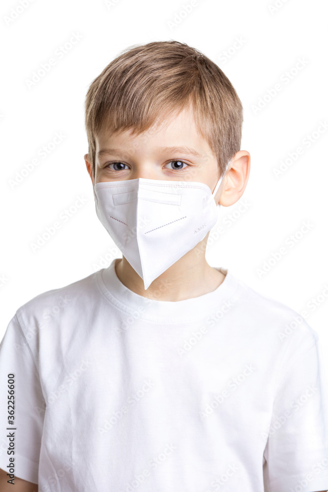 Portrait of young boy in medical mask over white Portrait of young boy in medical mask over white