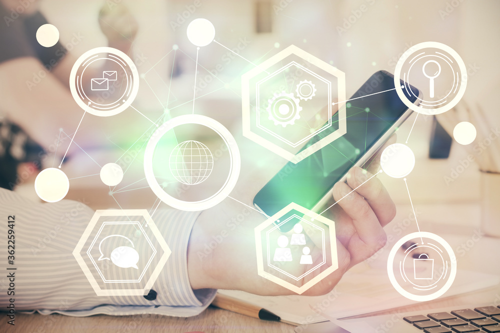Double exposure of man's hands holding and using a phone and social network theme drawing. Double exposure of man's hands holding and using a phone and social network theme drawing.